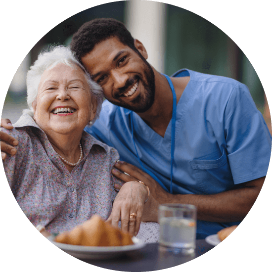 Caregiver having break fast with his client at cafe