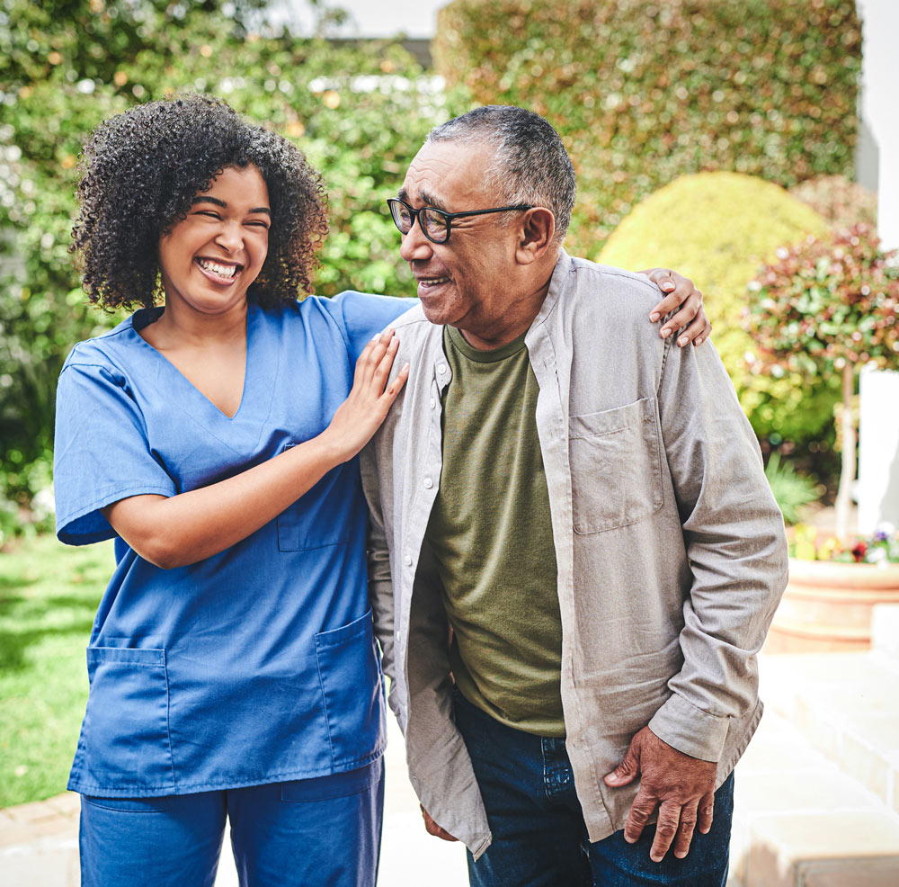 Nurse helping elderly man